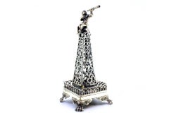 Silver toothpick holder cut in the shape of an obelisk