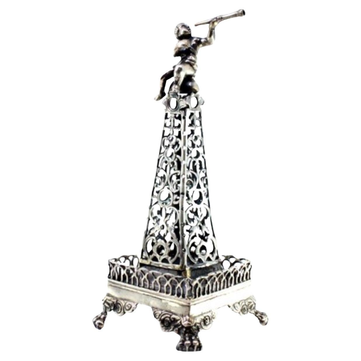 Silver toothpick holder cut in the shape of an obelisk