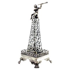 Silver toothpick holder cut in the shape of an obelisk