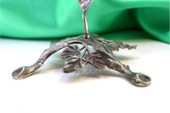 Silver toothpick holder in the shape of a climbing plant
