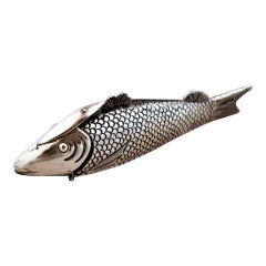 Silver toothpick holder in the shape of a fish