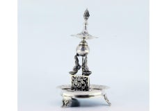 Silver toothpick holder in the shape of a fountain with fish