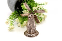 Silver toothpick holder in the shape of a mill with reliefs