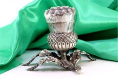 Silver toothpick holder in the shape of a pineapple w/ cut-out leaf applications