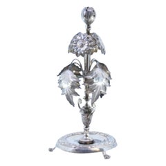 Silver toothpick holder w/ a set of flowers
acanthus leaves topped by a bulb