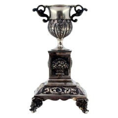 Silver toothpick holder w/ bowl on floral pedestal on square base with four feet