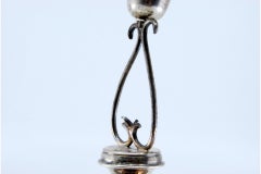 Silver toothpick holder w/ chalice & placed on an engraved base w/ three feet