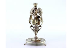 Silver toothpick holder w/ flowers in an engraved jar, suspended acanthus leaves