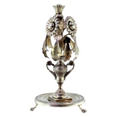 Silver toothpick holder w/ flowers in an engraved jar, suspended acanthus leaves
