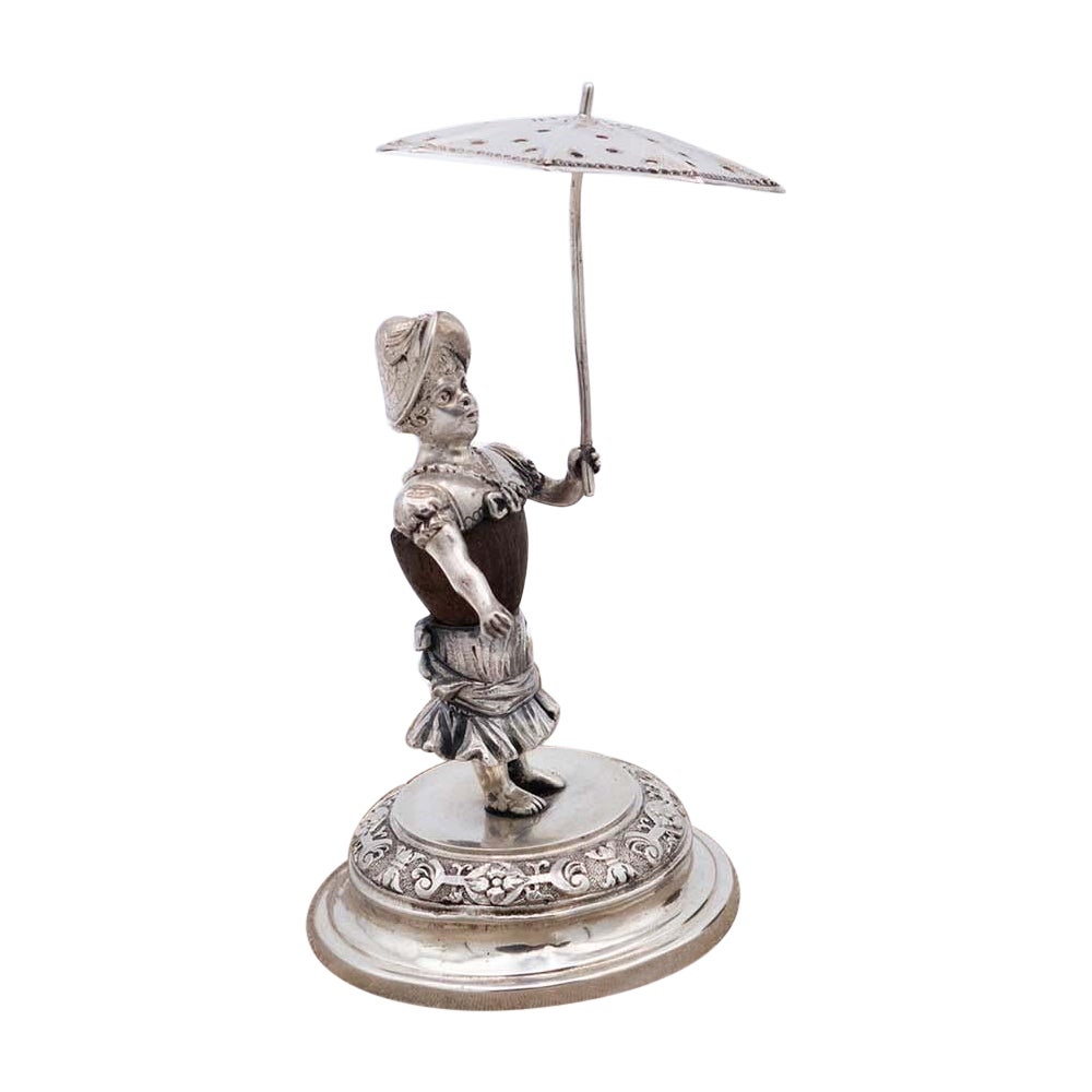 Silver toothpick holder with antique lady under umbrella