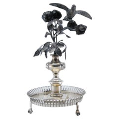 Silver toothpick holder with bird on bouquet on grid base with claws