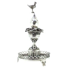 Silver toothpick holder with bird on fruit atop cutout plinth