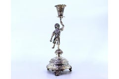 Silver toothpick holder with boy on plinth, second floral chalice