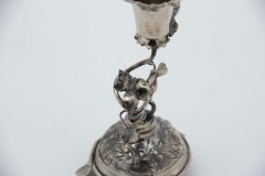 Silver toothpick holder with chalice on a pitcher