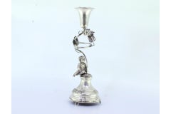Silver toothpick holder with chalice supported on acanthus and seated child