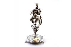 Silver toothpick holder with floral reliefs and applications