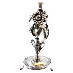 Silver toothpick holder with floral reliefs and applications