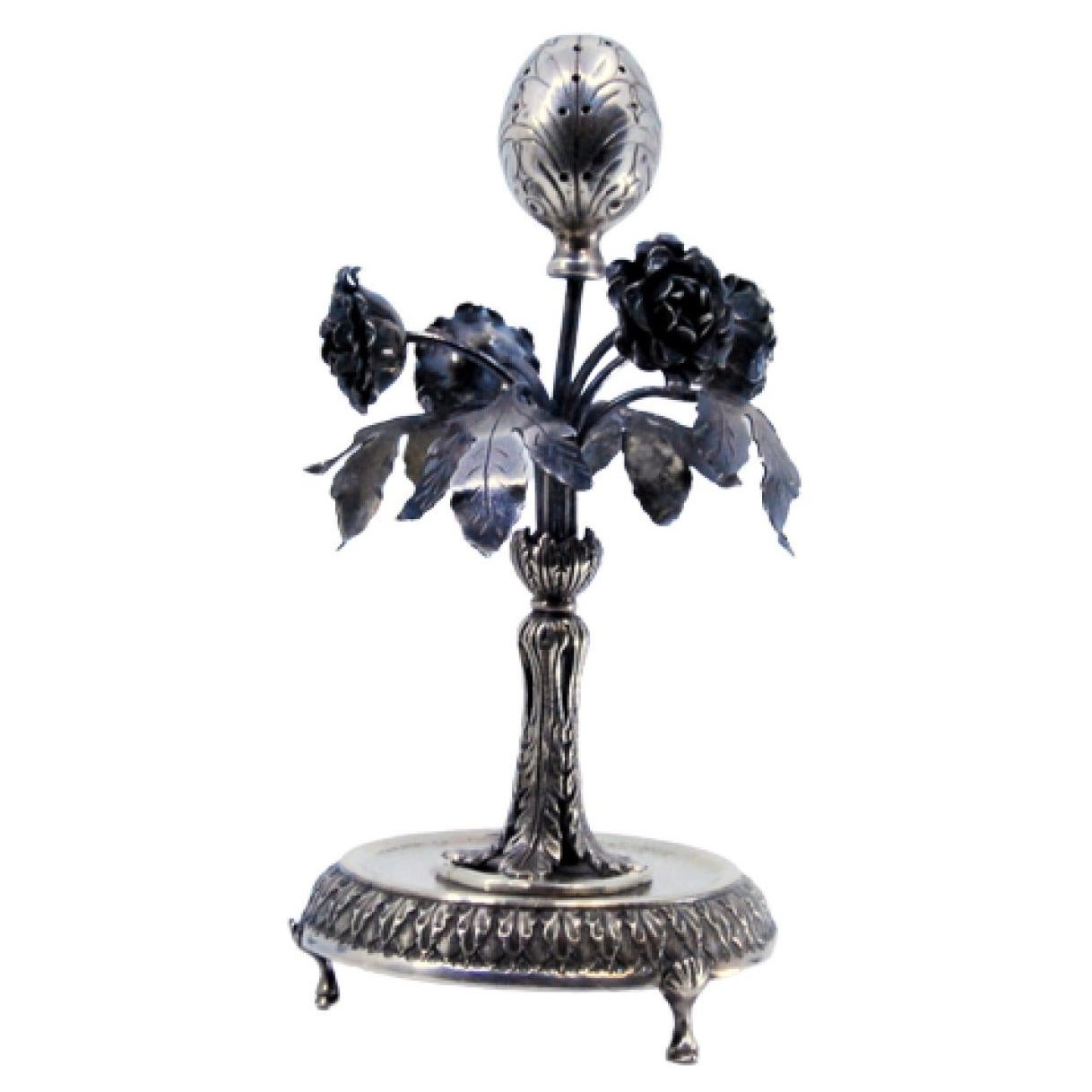 Silver toothpick holder with flowers, leaves, palms and resting on a raised base