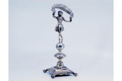 Silver toothpick holder with lady holding a flower bow