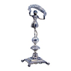 Silver toothpick holder with lady holding a flower bow