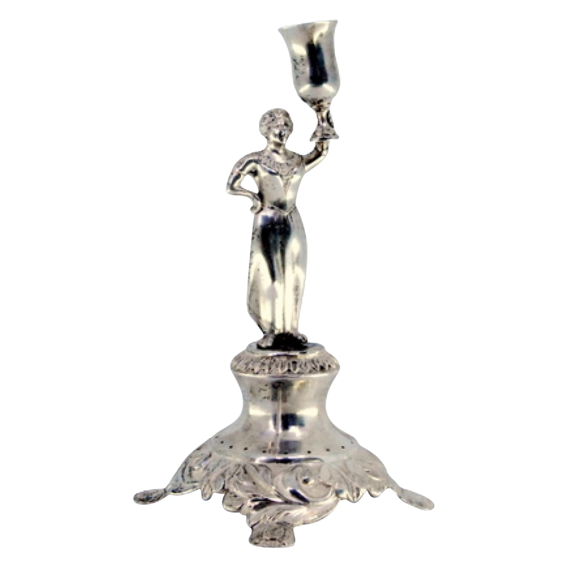 Silver toothpick holder with lady holding cup on raised base with three feet