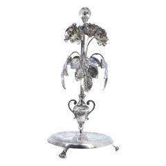 Silver toothpick holder with leaves, flowers, bulb, on circular engraved base
