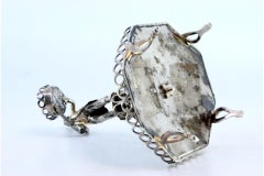 Silver toothpick holder with male figure standing on a pedestal