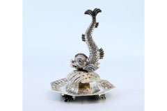 Silver toothpick holder with mermaid figure resting on a shell