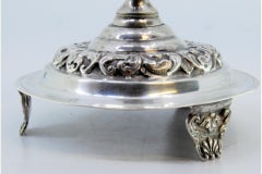Silver toothpick holder with palm tree ball on a base with engraved scrolls