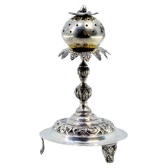 Silver toothpick holder with palm tree ball on a base with engraved scrolls