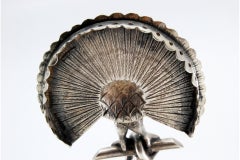 Silver toothpick holder with peacock perched on a pear tree