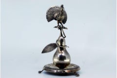 Silver toothpick holder with peacock perched on a pear tree