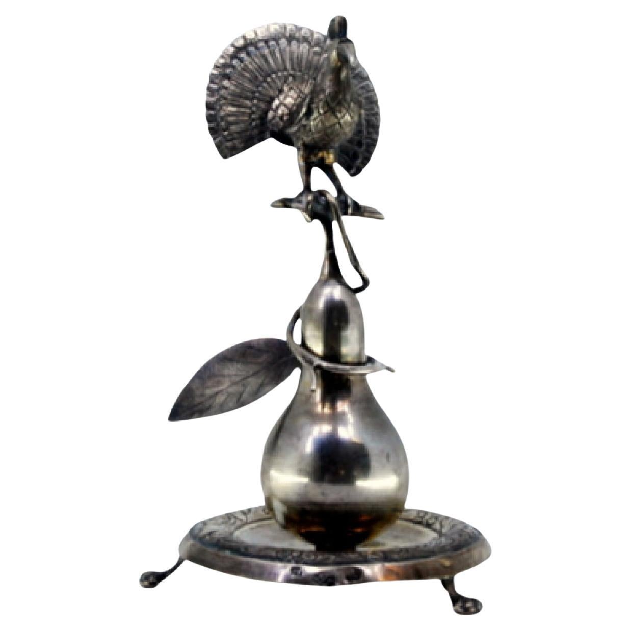 Silver toothpick holder with peacock perched on a pear tree