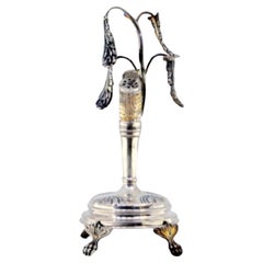 Silver toothpick holder with plant branches on a tree trunk