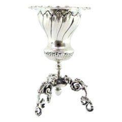 Silver toothpick holder with reliefs on three tall openwork feet 
applications