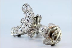 Silver toothpick holder with swans on plinth and acanthus flower on tripod base