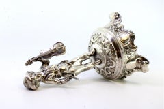 Silver toothpick holder with violinist on raised plinth on three scrolled feet