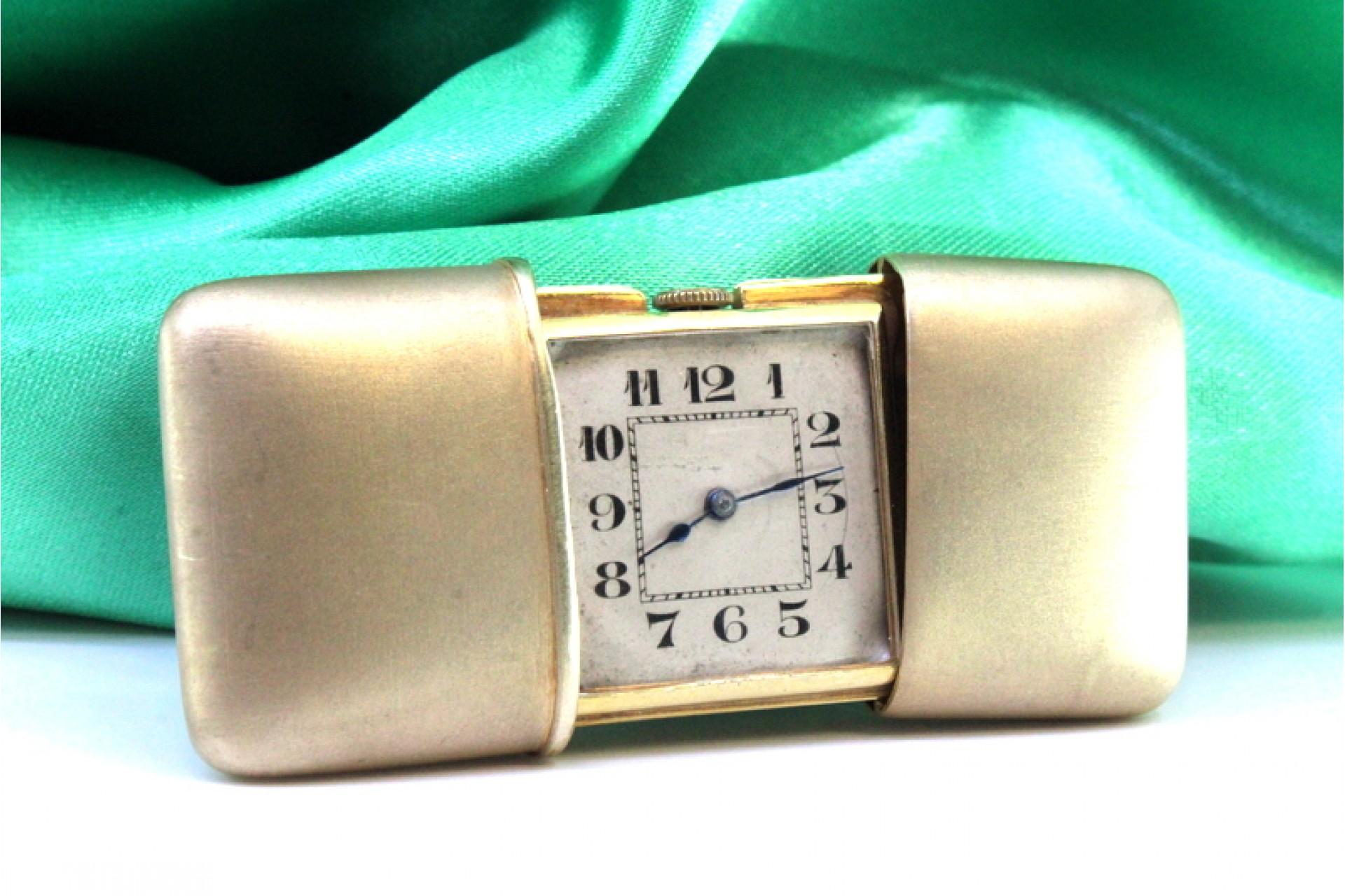 Silver travel watch with gold mechanical movement