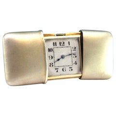 Silver travel watch with gold mechanical movement