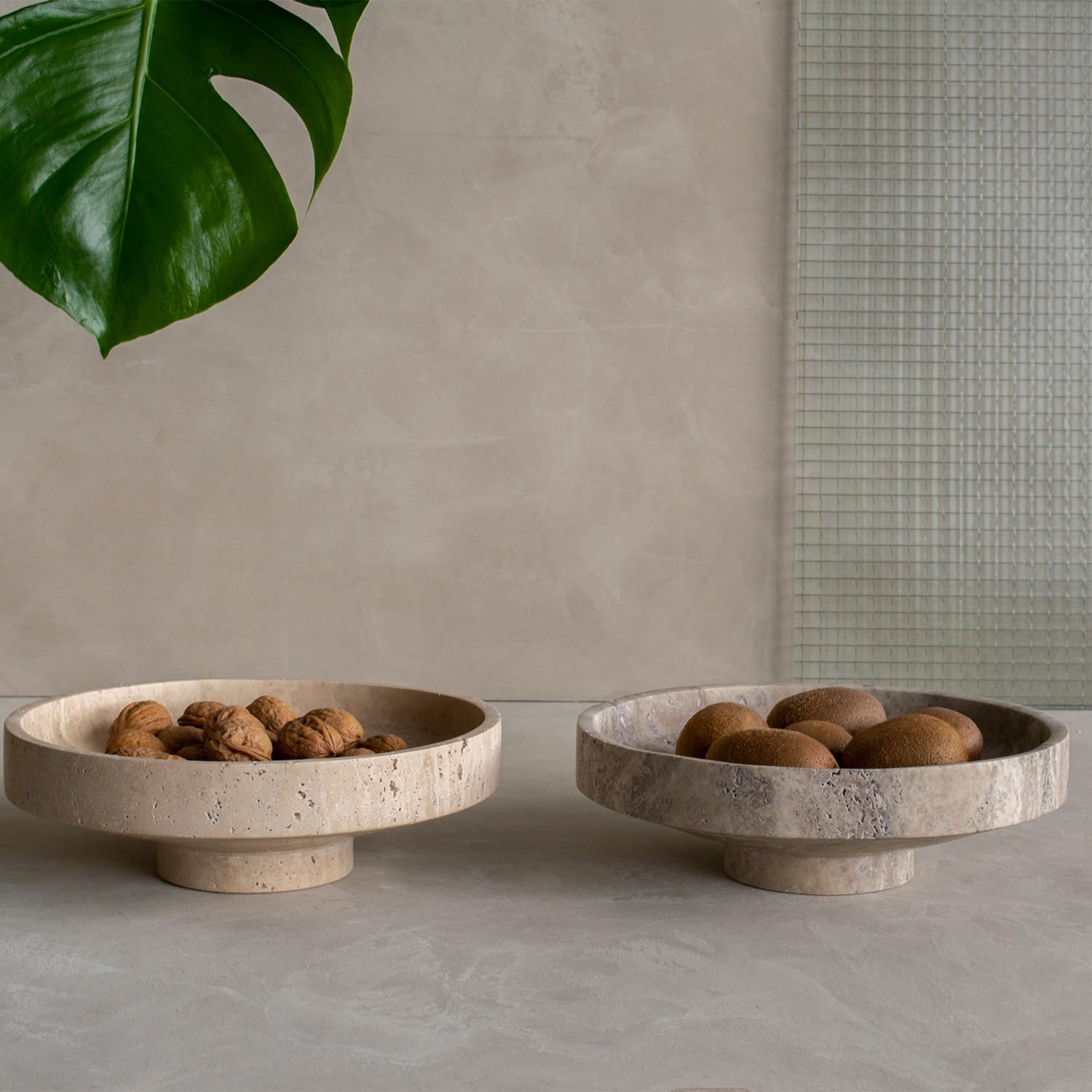 Stunning, aesthetic, timeless are words that can be used to describe this elegant and modern travertine bowl from Kiwano. Expertly crafted and finished by hand, our travertine bowls are a study in sculptural simplicity. Natural variations in the