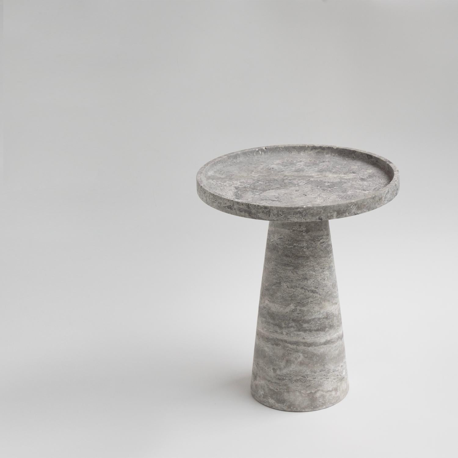 Add a touch of elegance to any room with this stunning Silver Travertine Side Table. The conical shape of this side table works with a variety of interior aesthetics from traditional to contemporary. Perfect for placing next to a sofa, chair or bed,