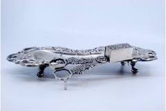 Silver tray and scissors with floral and shell motifs