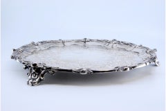 Silver tray w/ floral engravings, shell friezes & 3 feet