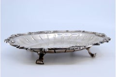 Silver tray w/ raised base, engravings & scroll frieze on 4 feet
