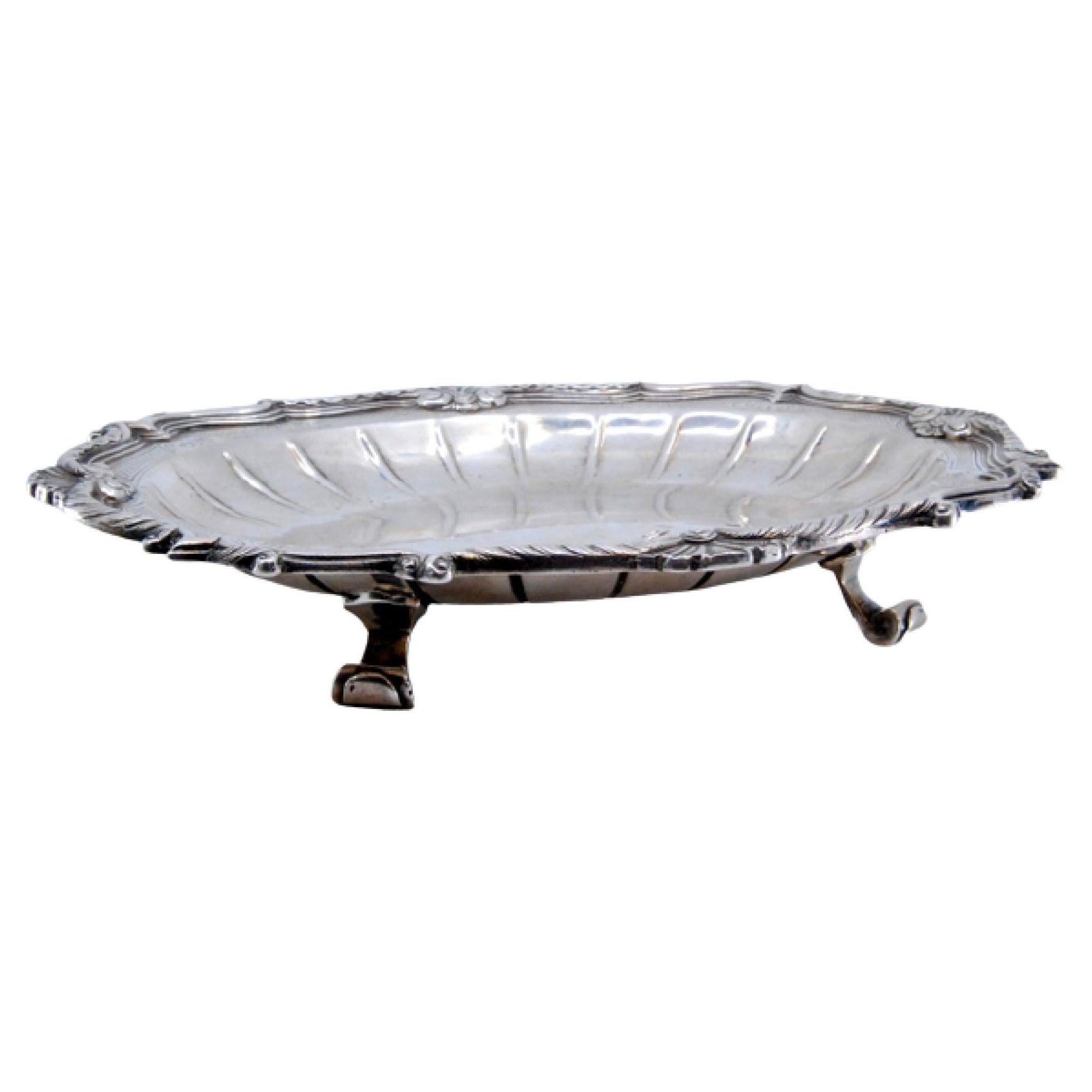 Silver tray w/ raised base, engravings 
scroll frieze on 4 feet