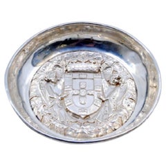 Silver tray with angelic figures holding the coat of arms of Portugal
