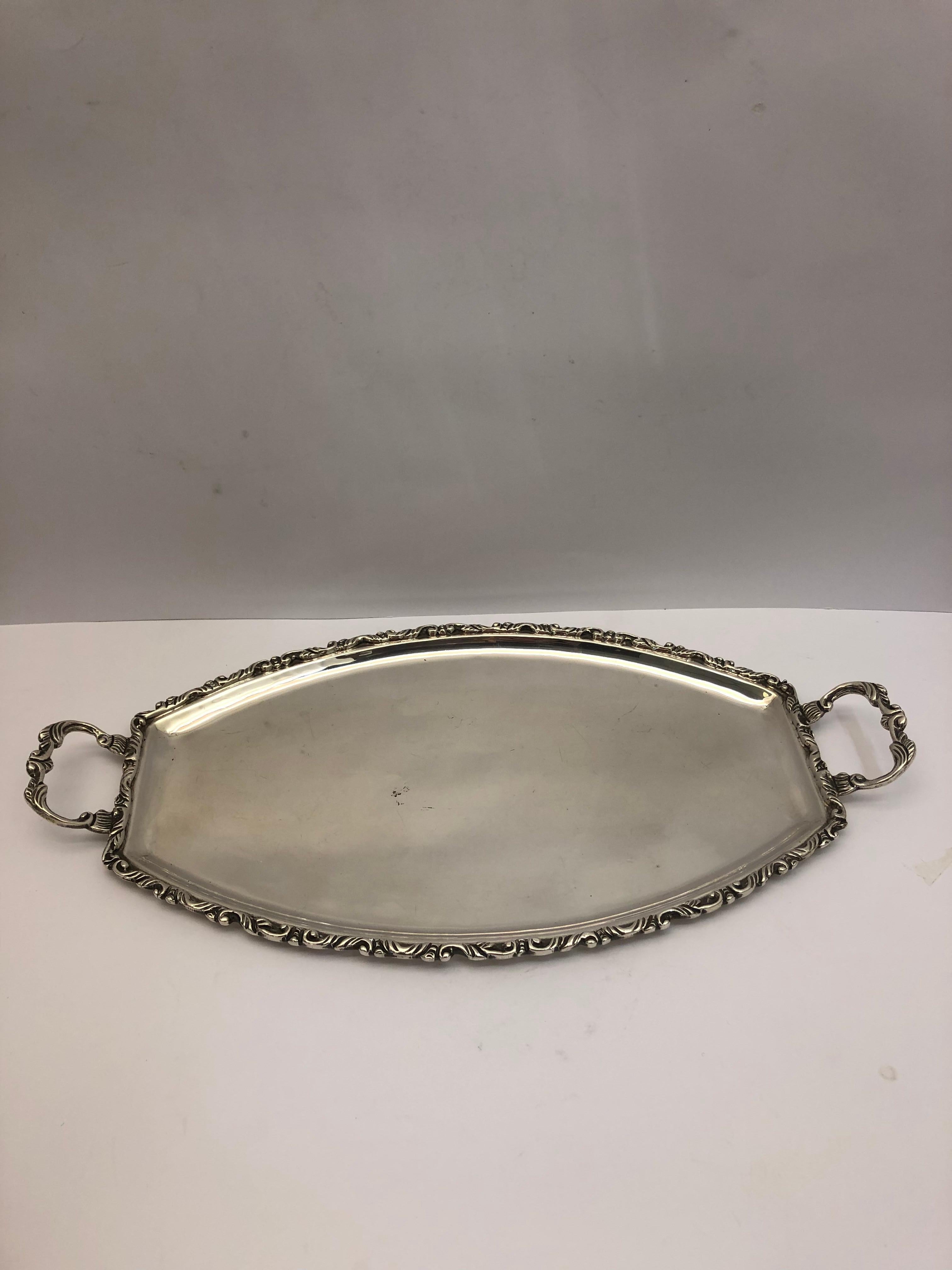 Two-handled silver tray with decorated border & handles, hallmarked 925 silver. Made in Mexico.
