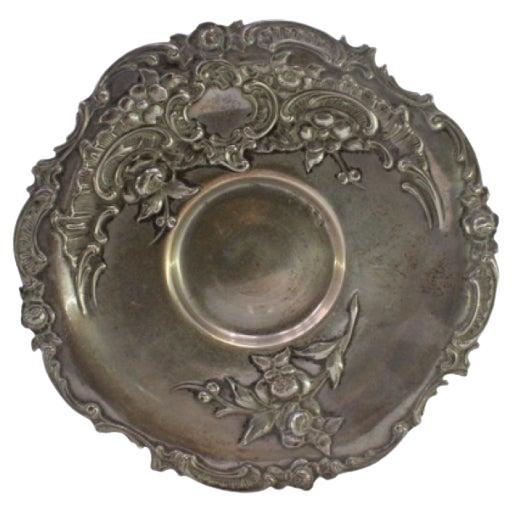 Silver tray with floral reliefs, scrolls surrounding a monogram card