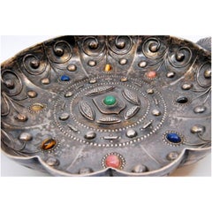 Silver tray with inlaid colored stones and raised handles in the shape of shells