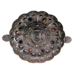 Silver tray with inlaid colored stones and raised handles in the shape of shells